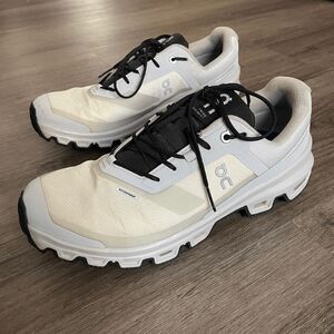 On Running White and Black Athletic Shoes